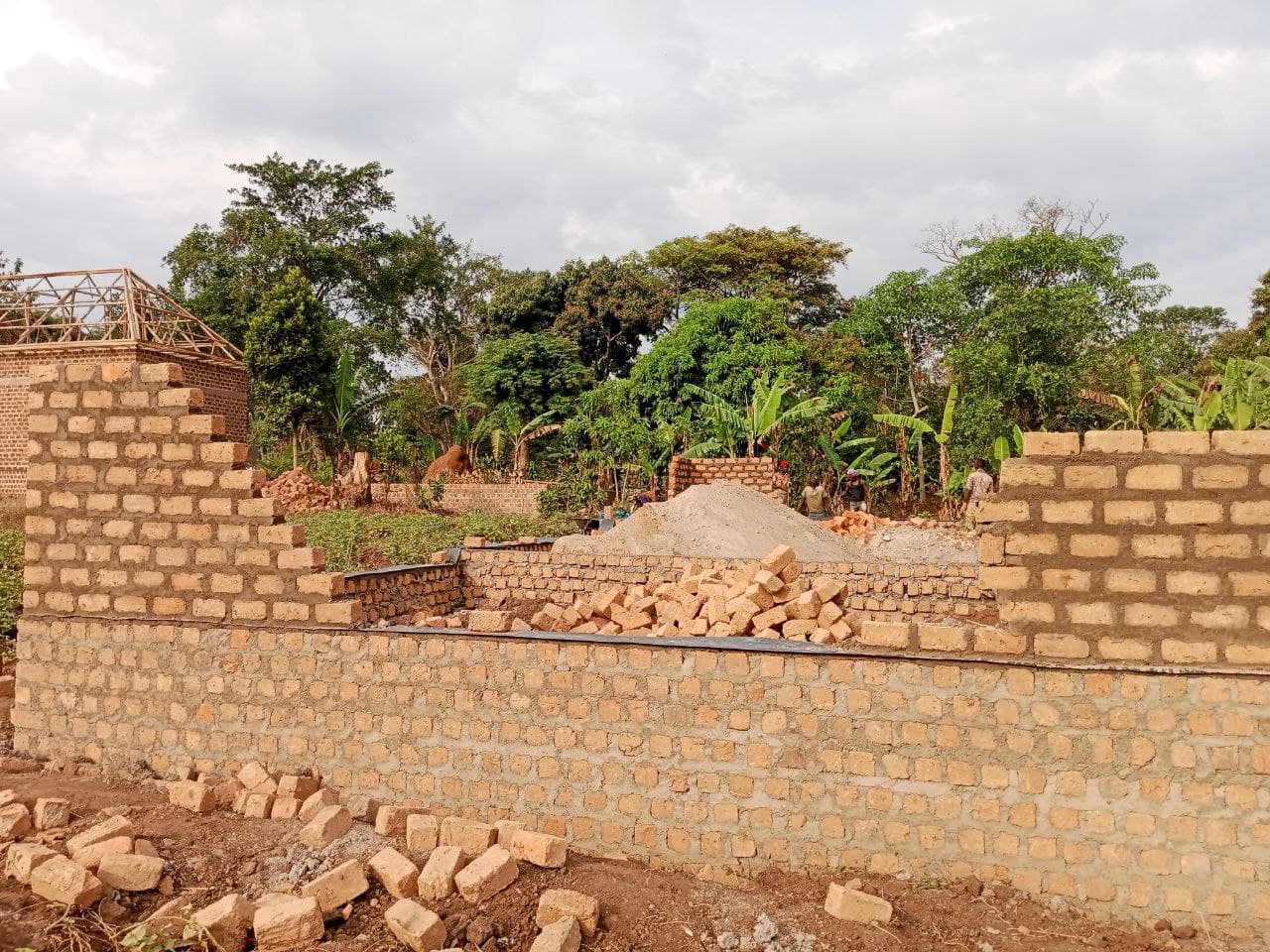 Partially built brick wall of the new elementary school building under construction.