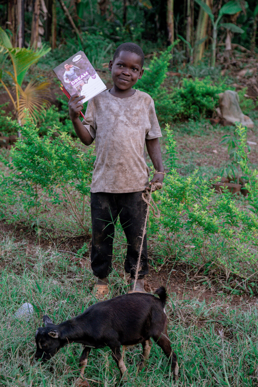 A kid rearing a goat